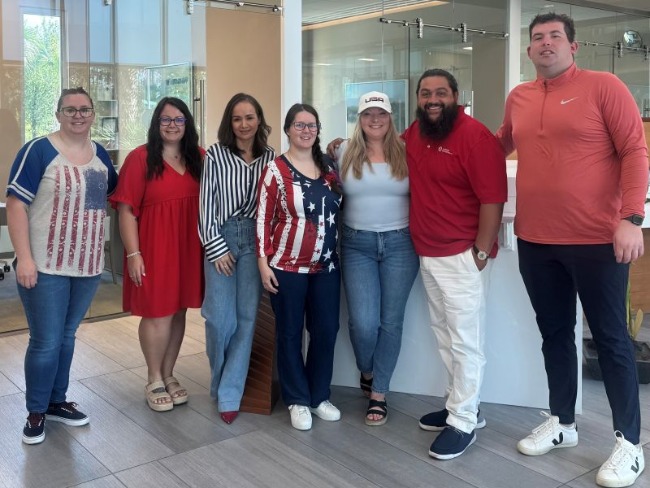 Market Common employees dressed in red, white, and blue to celebrate America's 250th birthday.